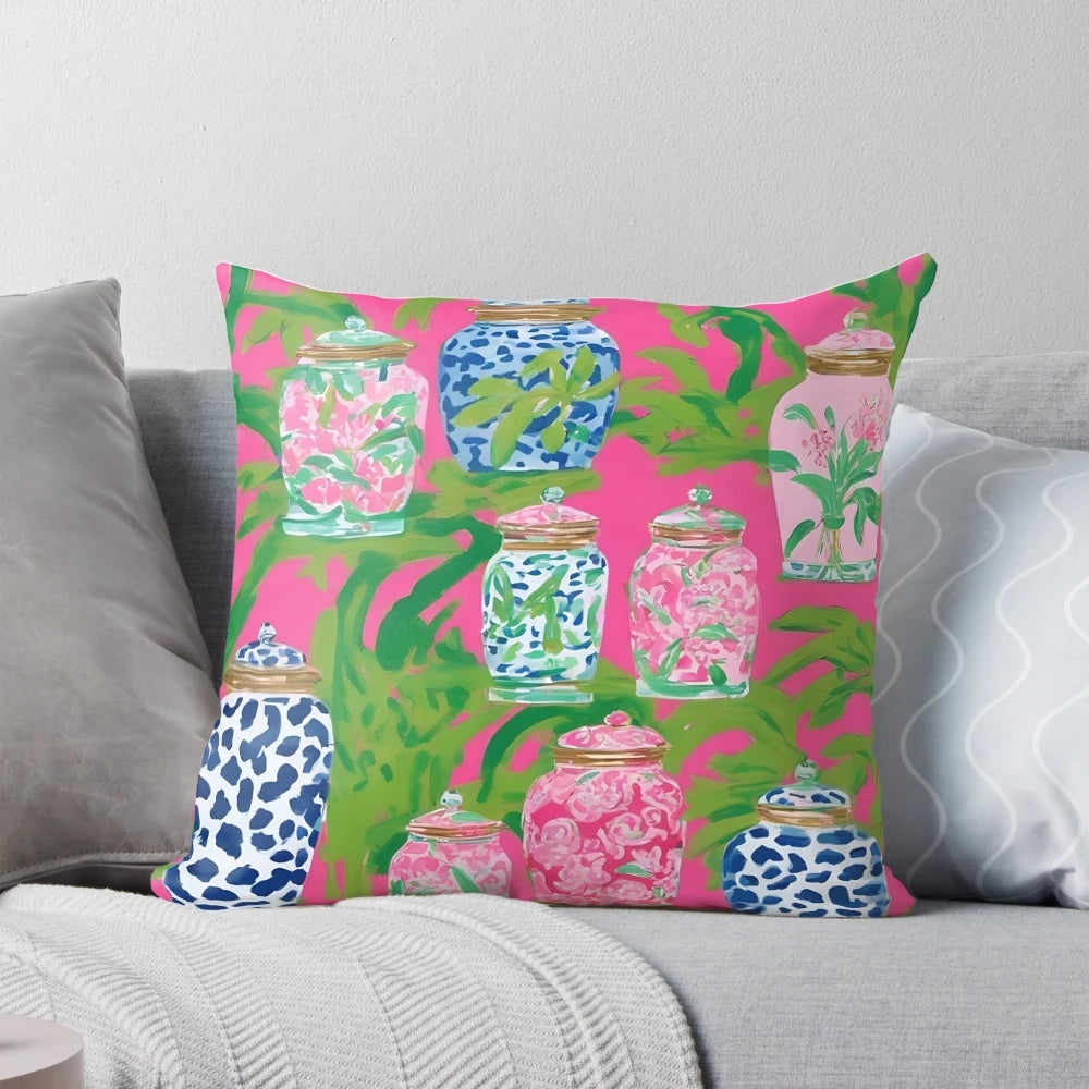 Stylish chinoiserie ginger jars and tropical banana leaves printed on a hot pink decorative pillow