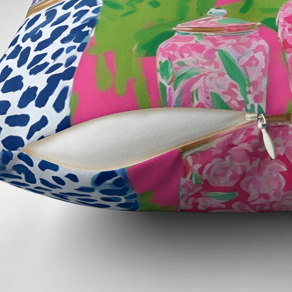 Stylish chinoiserie ginger jars and tropical banana leaves printed on a hot pink decorative pillow