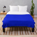 Cobalt blue plush blanket with a soft, vibrant hue