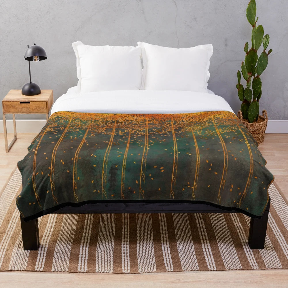 Closeup of a metallic copper plush blanket with botanical birch tree print