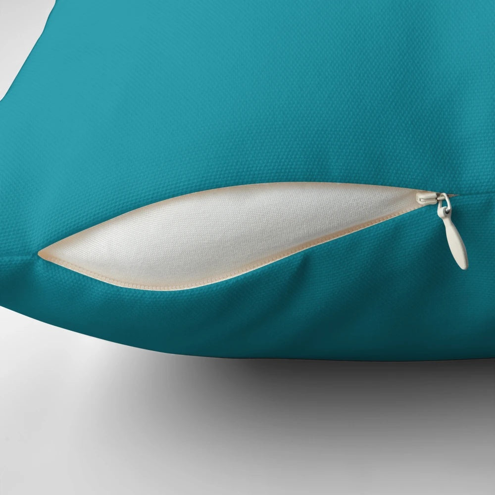 Deep teal blue and turquoise colored decorative pillow