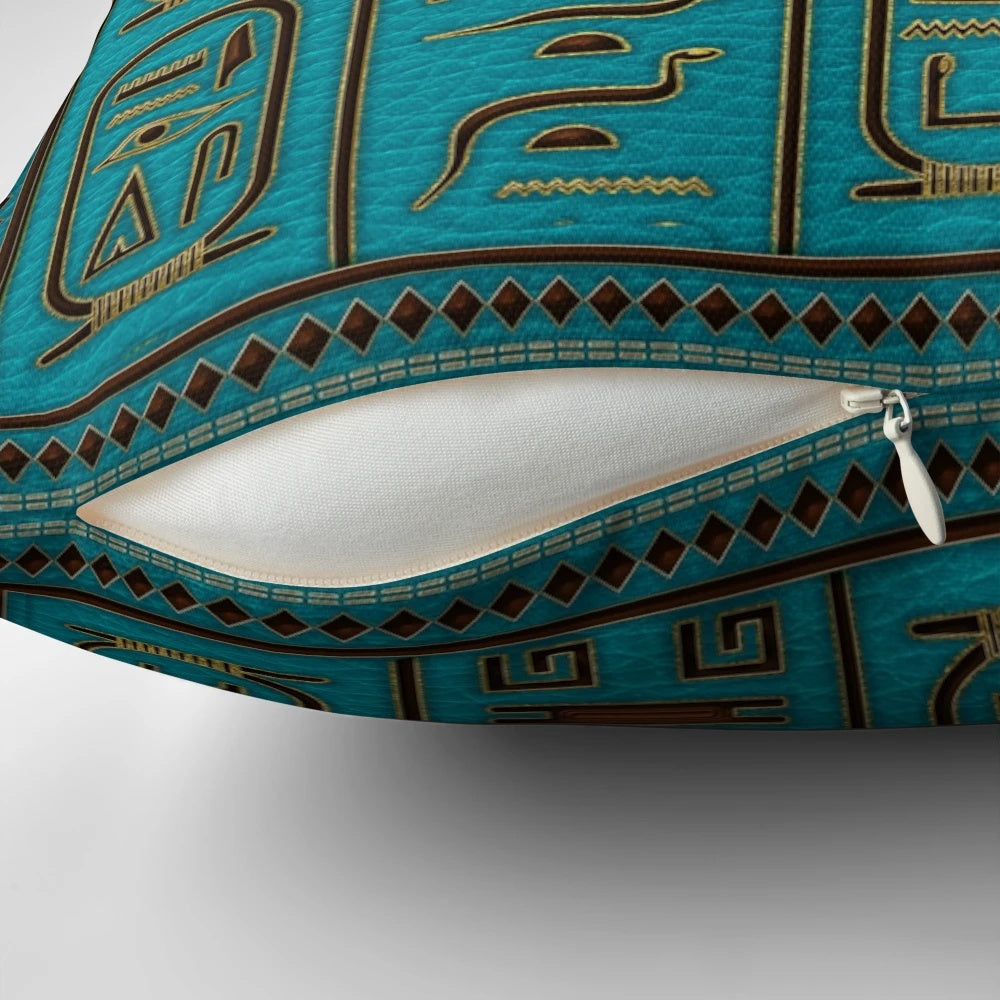 Decorative Egyptian leather pillow with gold hieroglyphic embossing on a teal background