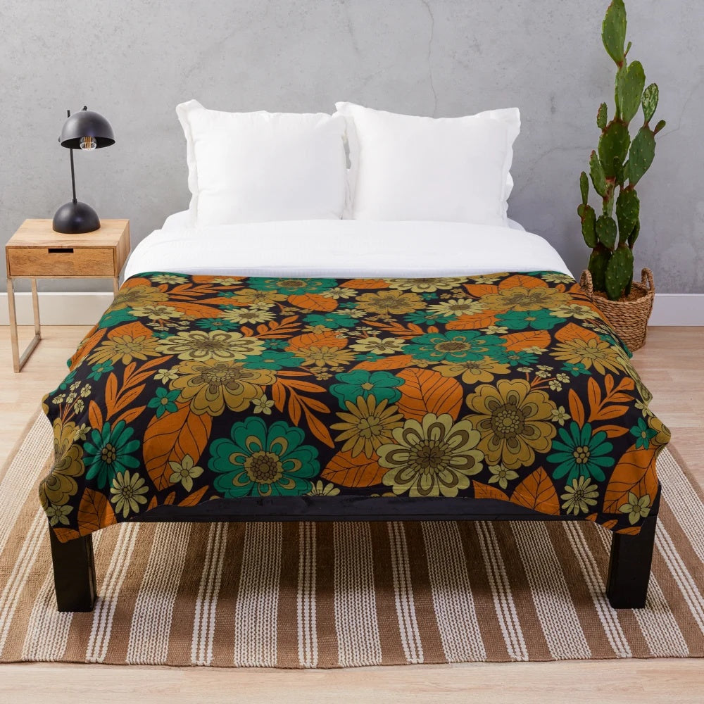 Plush floral blanket in teal and orange colors