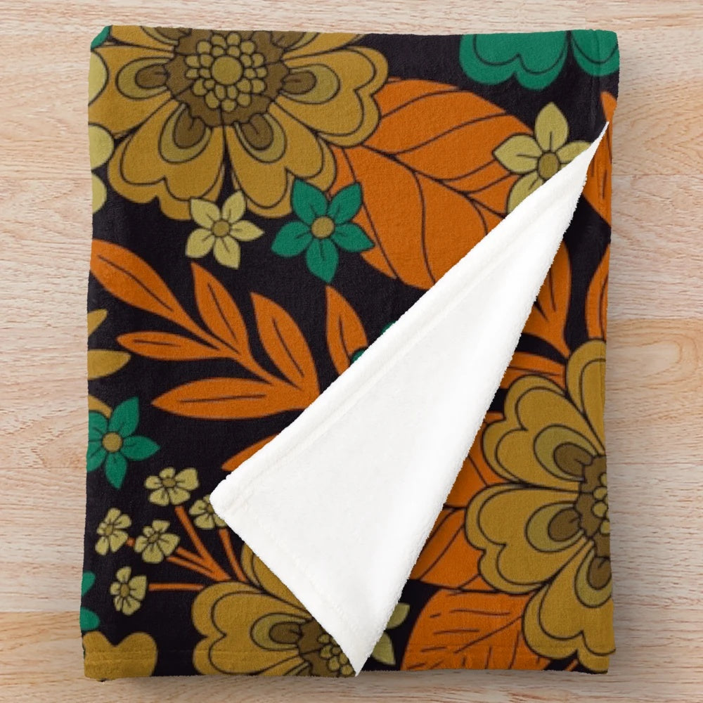 Plush floral blanket in teal and orange colors