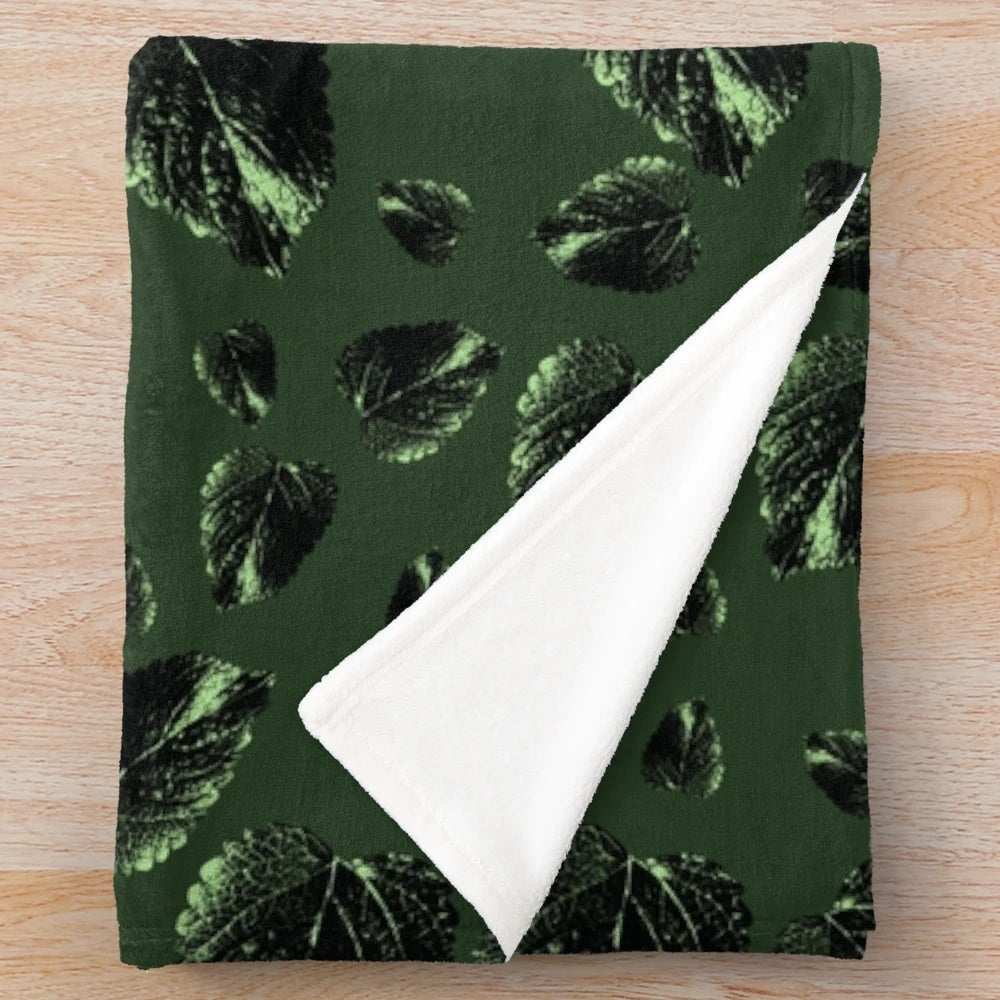 Forest green velvet plush blanket with botanical leaf pattern