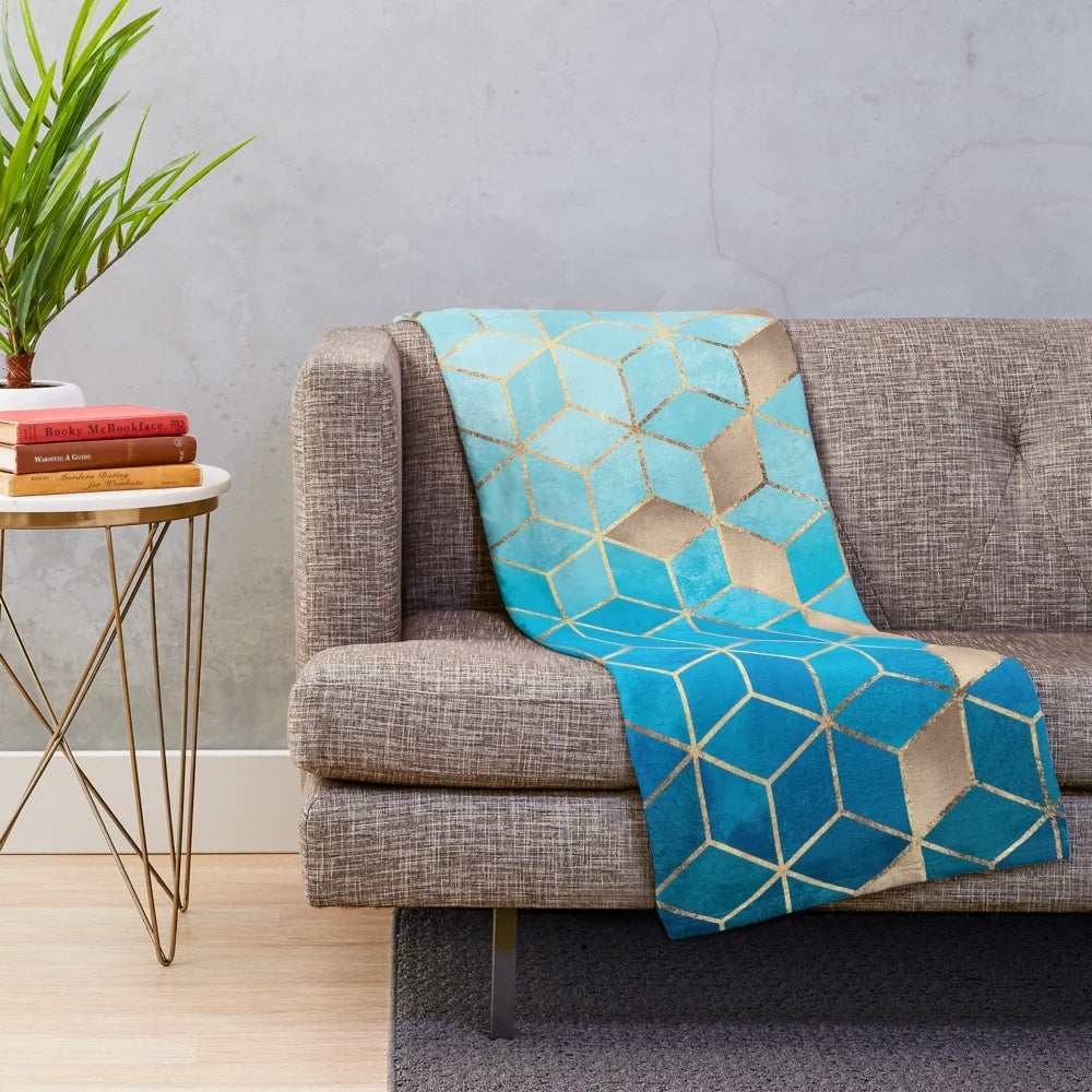 Plush blue and gold geometric cube pattern blanket