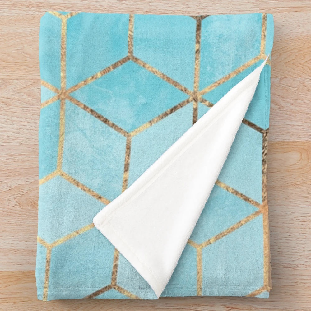 Plush blue and gold geometric cube pattern blanket