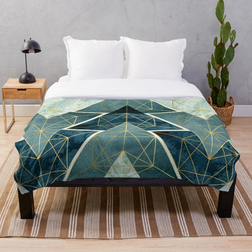 Geometric teal plush blanket with abstract pattern
