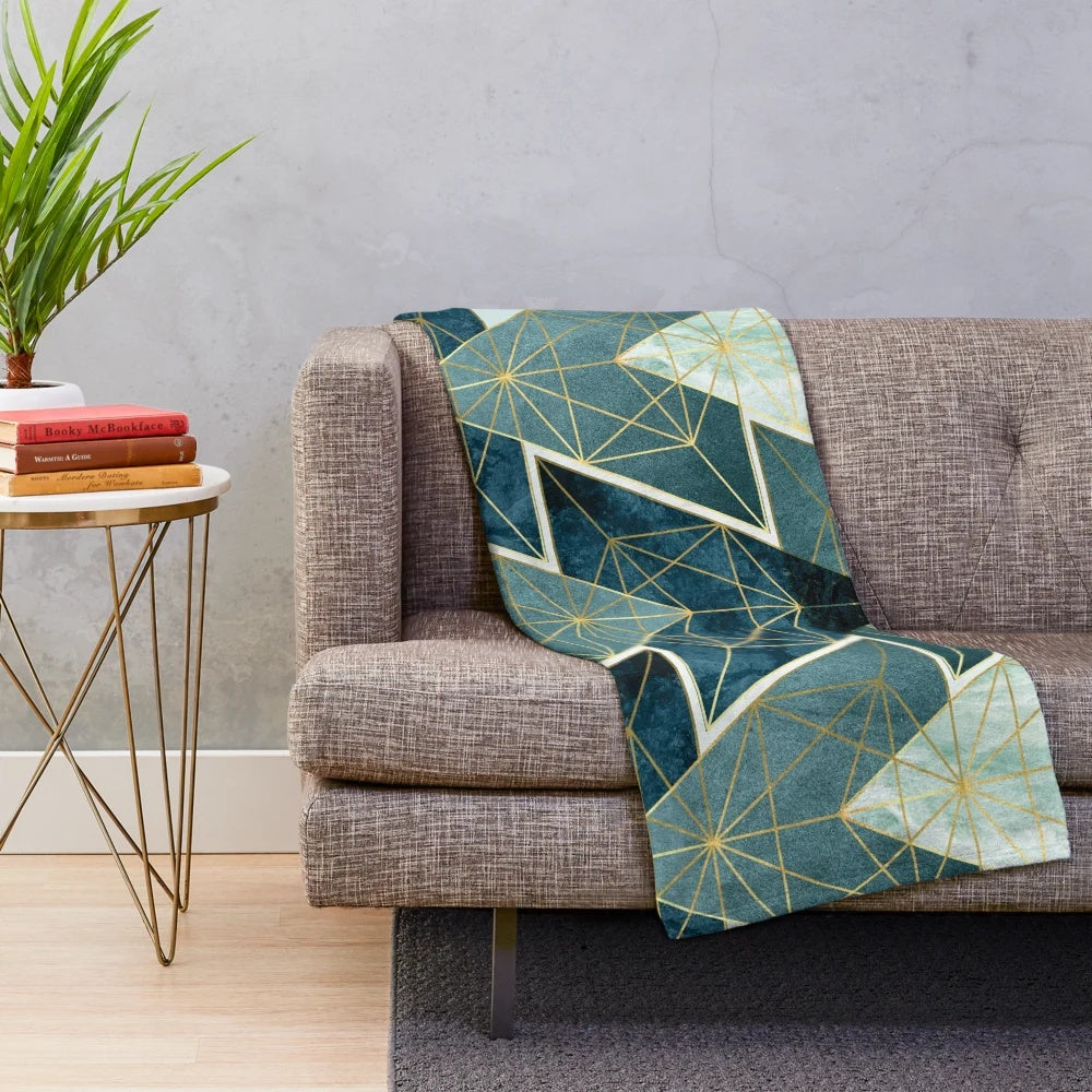 Geometric teal plush blanket with abstract pattern