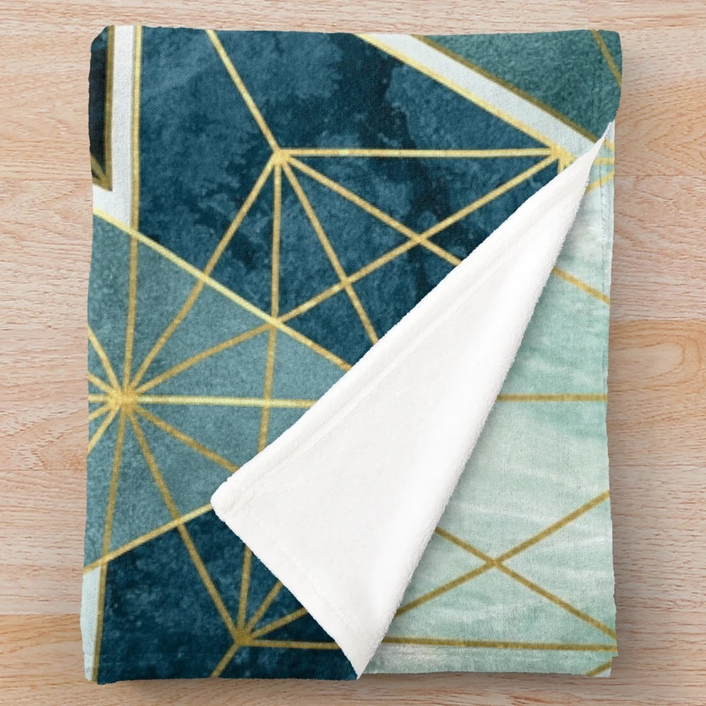 Geometric teal plush blanket with abstract pattern