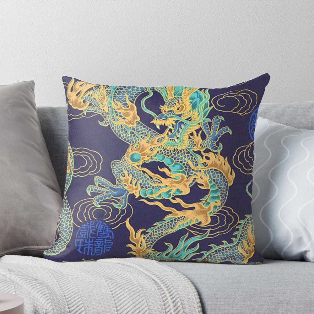 Vibrant turquoise and gold gilded dragon pattern on a decorative throw pillow