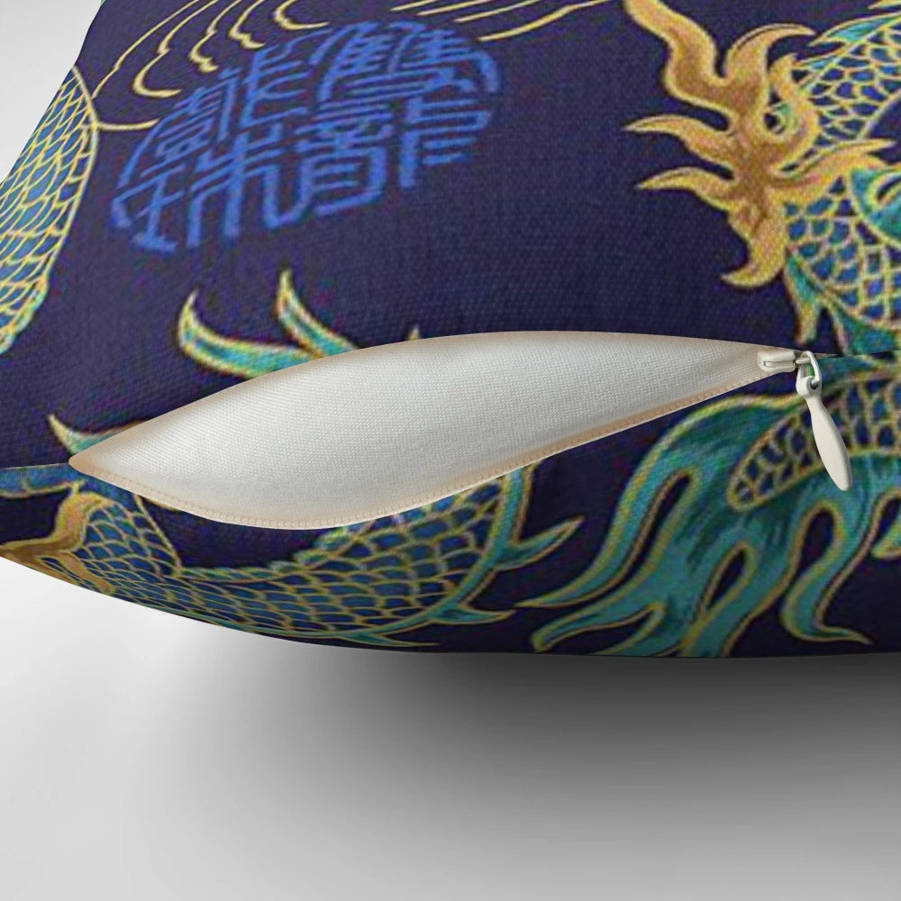 Vibrant turquoise and gold gilded dragon pattern on a decorative throw pillow