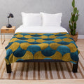 Soft and cozy plush blanket with a luxurious gold and teal pattern inspired by the vibrant city of Dubai