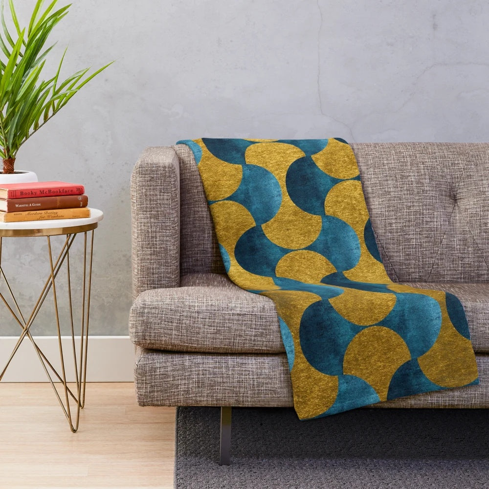 Soft and cozy plush blanket with a luxurious gold and teal pattern inspired by the vibrant city of Dubai