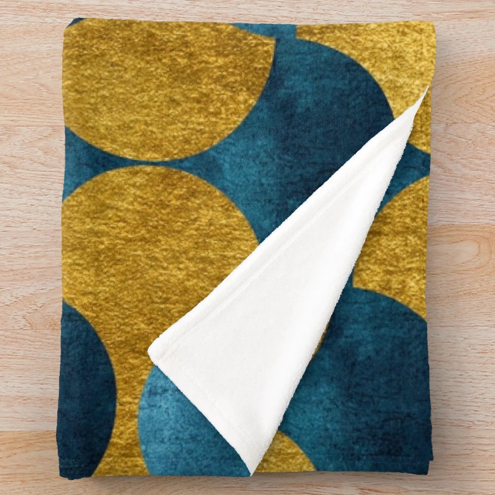 Soft and cozy plush blanket with a luxurious gold and teal pattern inspired by the vibrant city of Dubai