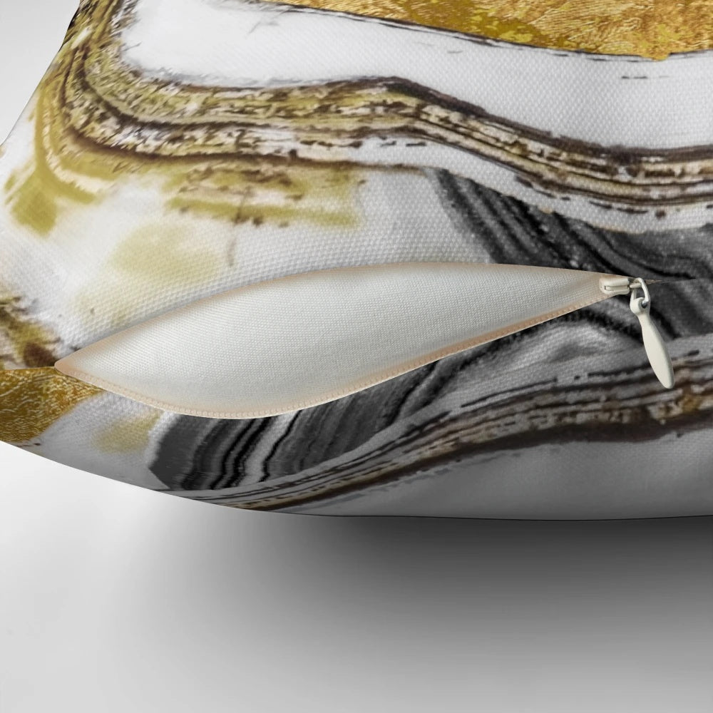 Cozy gold and black stone-like patterned pillow with a natural, geode-inspired design.
