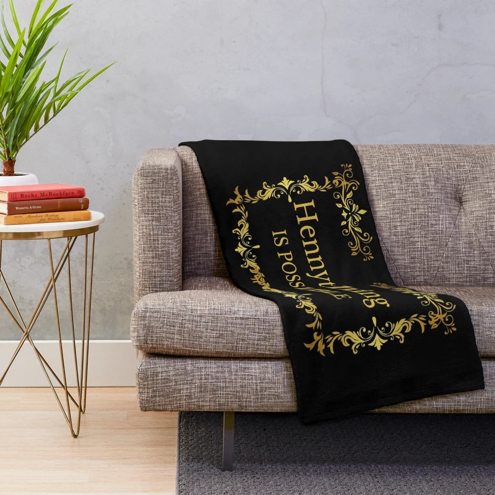 Luxurious gold plush blanket with "Hennything is Possible" design