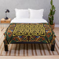 Gold plush blanket with Celtic knot design and medieval hounds border