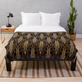 Glamorous gold-colored art deco patterned plush blanket