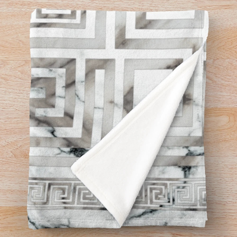 Greek key and meander pattern plush blanket with white marble textures