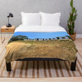 Plush blanket featuring a scenic landscape with mountains, sky, and nature