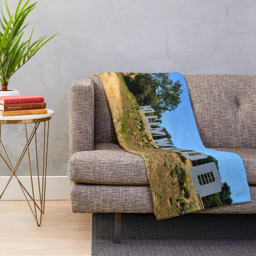 Plush blanket featuring a scenic landscape with mountains, sky, and nature