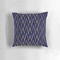Indigo and gold art deco patterned throw pillow with diamond shapes and architectural design