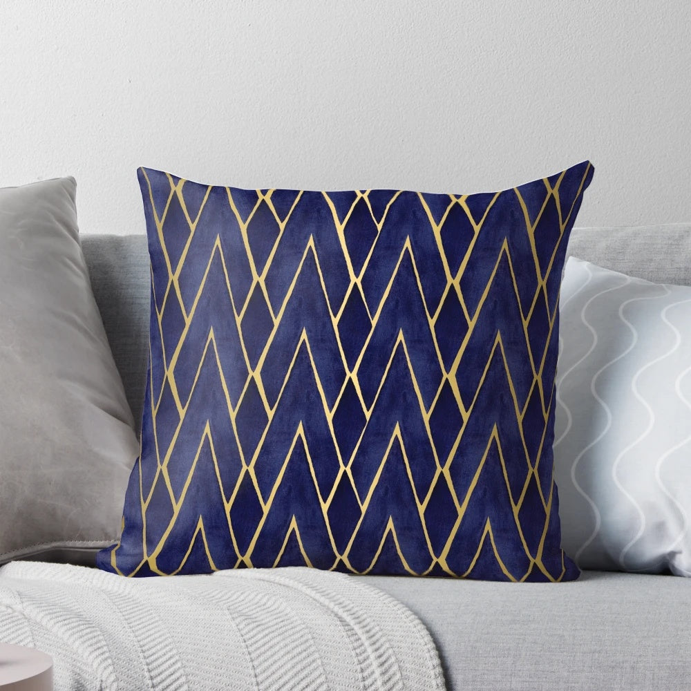 Indigo and gold art deco patterned throw pillow with diamond shapes and architectural design