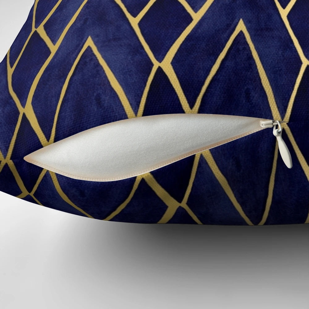 Indigo and gold art deco patterned throw pillow with diamond shapes and architectural design
