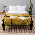 Soft and cozy plush blanket featuring a beautiful golden crane design inspired by Japanese art