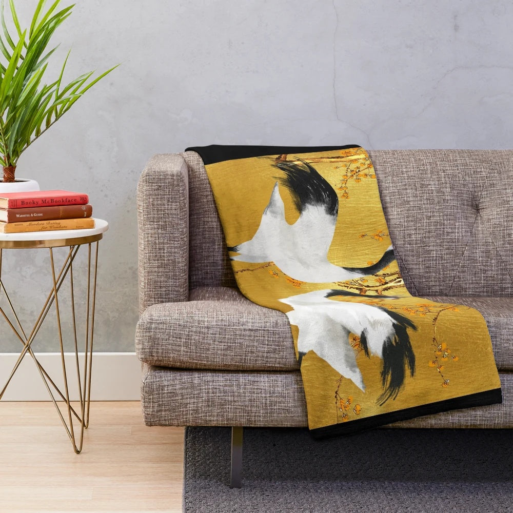 Soft and cozy plush blanket featuring a beautiful golden crane design inspired by Japanese art