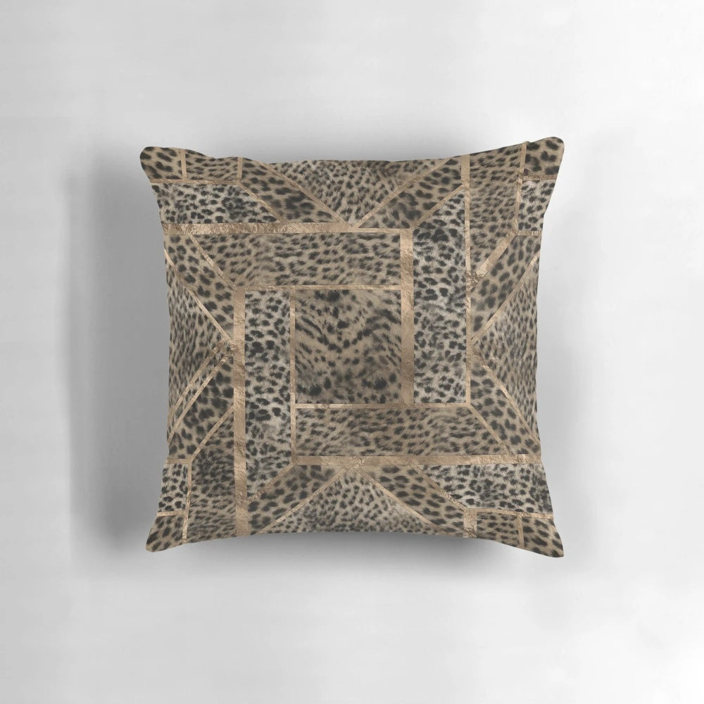 Closeup view of a leopard print pillow with a geometric pattern and a soft, plush faux fur texture.