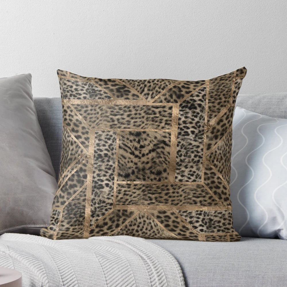 Closeup view of a leopard print pillow with a geometric pattern and a soft, plush faux fur texture.