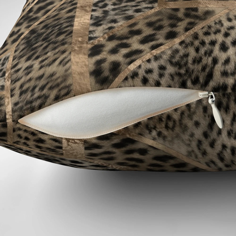 Closeup view of a leopard print pillow with a geometric pattern and a soft, plush faux fur texture.