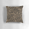 Leopard print pillow with a traditional color palette of browns and beiges