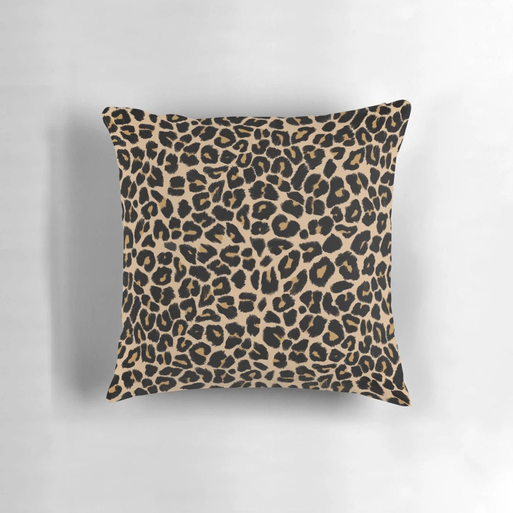 Leopard print pillow with a traditional color palette of browns and beiges