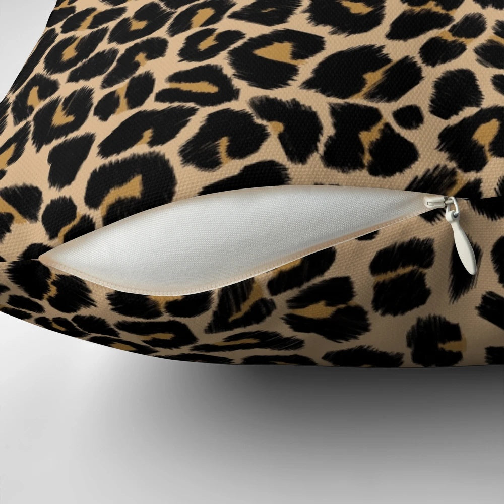 Leopard print pillow with a traditional color palette of browns and beiges
