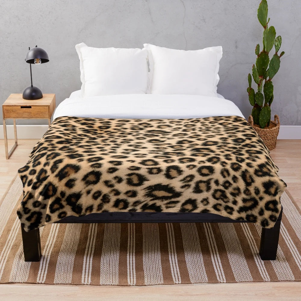 Leopard print plush blanket with soft faux fur texture