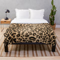 Leopard print plush blanket with soft faux fur texture