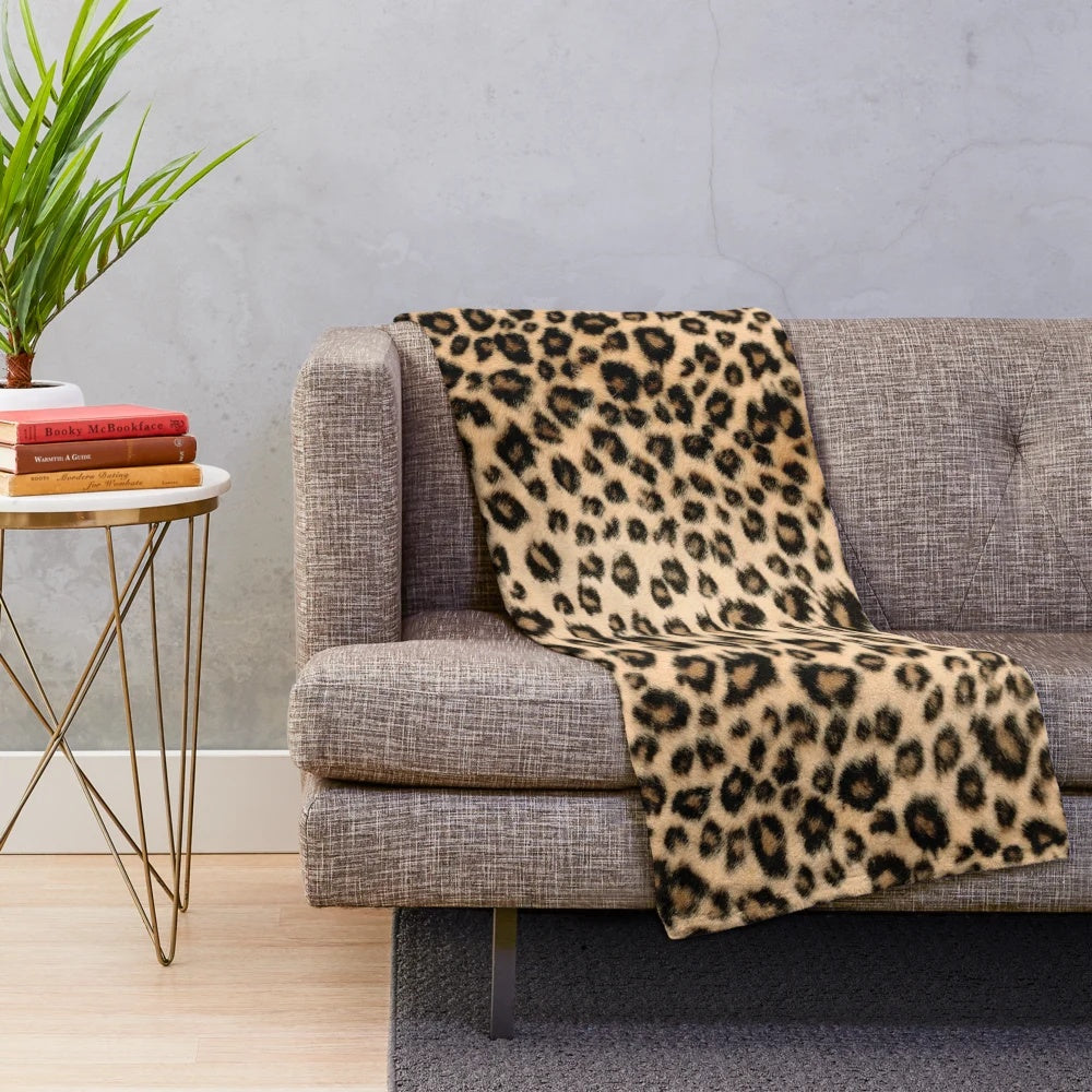 Leopard print plush blanket with soft faux fur texture