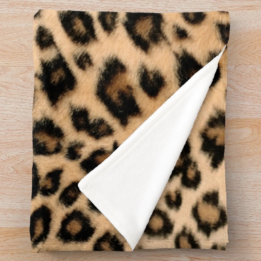 Leopard print plush blanket with soft faux fur texture