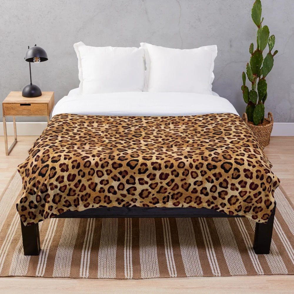 Leopard print plush blanket with a stylish, rustic texture