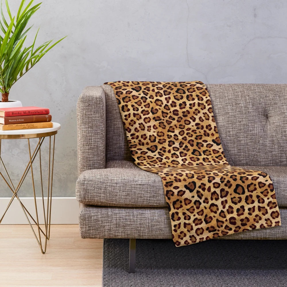 Leopard print plush blanket with a stylish, rustic texture