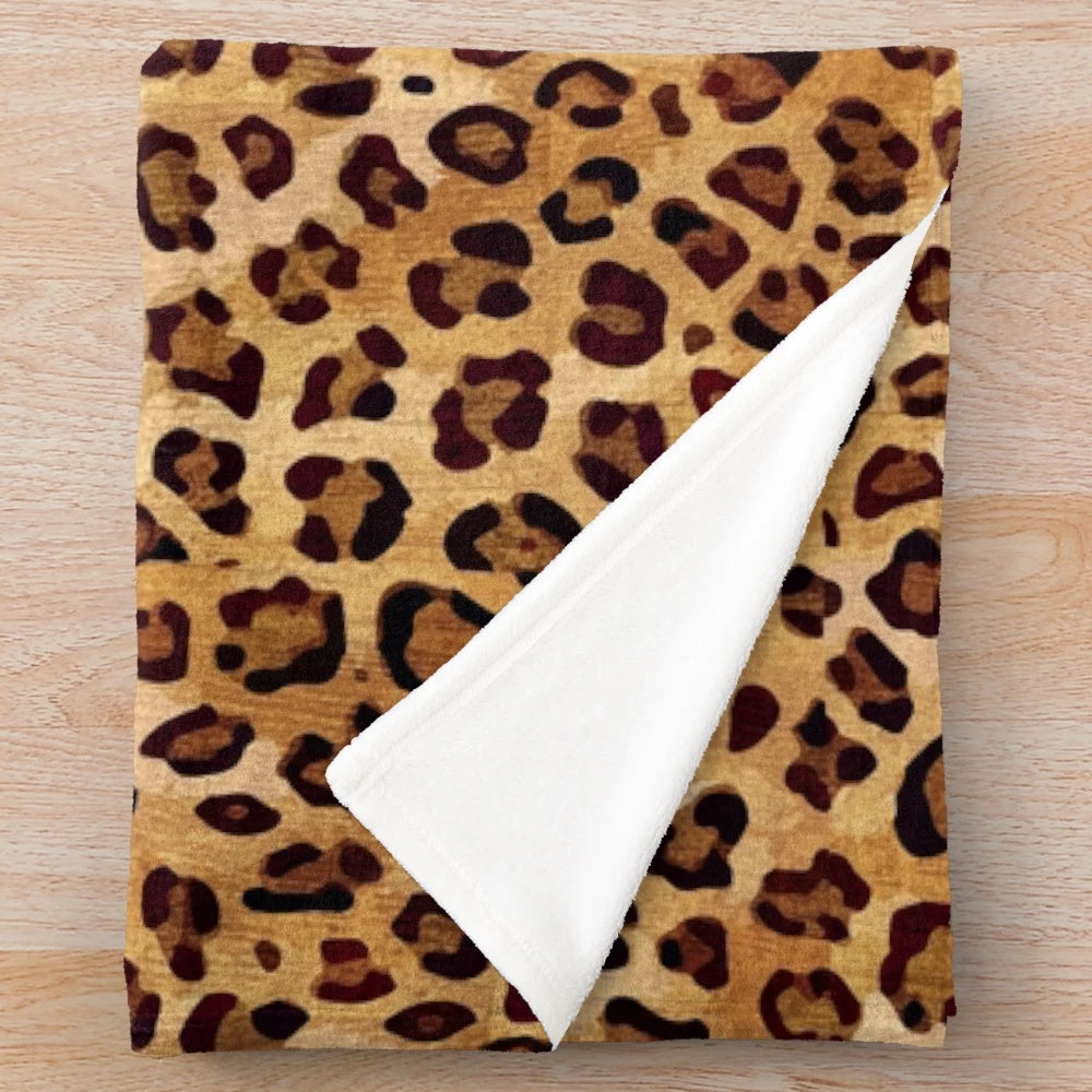 Leopard print plush blanket with a stylish, rustic texture