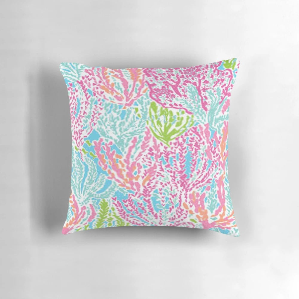 Lilly inspired print pillow in coral, green, and blue colors