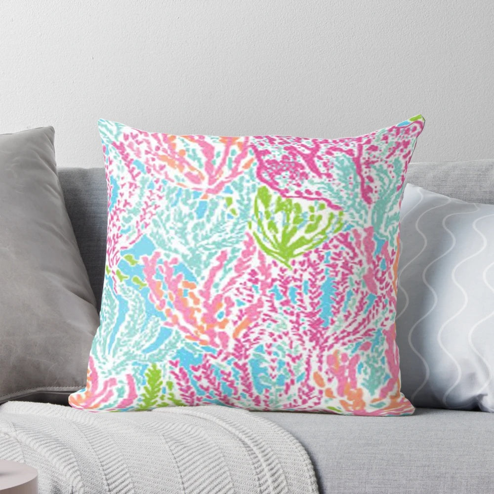 Lilly inspired print pillow in coral, green, and blue colors