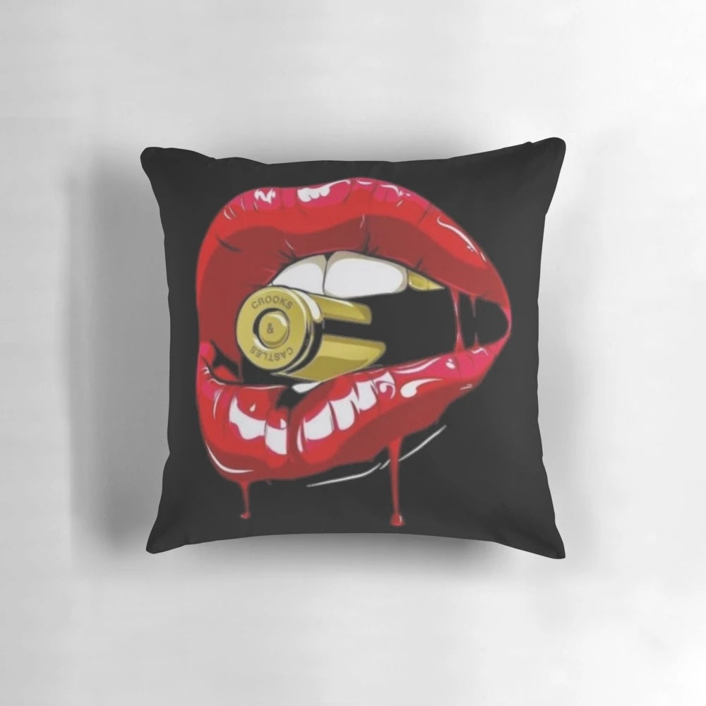 Stunning metallic pillow featuring a woman's lips holding a bullet, perfect for adding a touch of glamour to any bedroom.