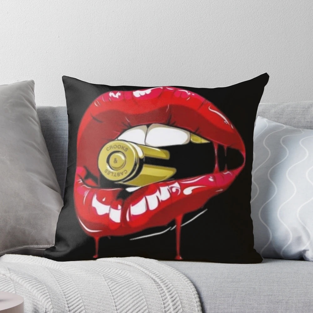 Stunning metallic pillow featuring a woman's lips holding a bullet, perfect for adding a touch of glamour to any bedroom.