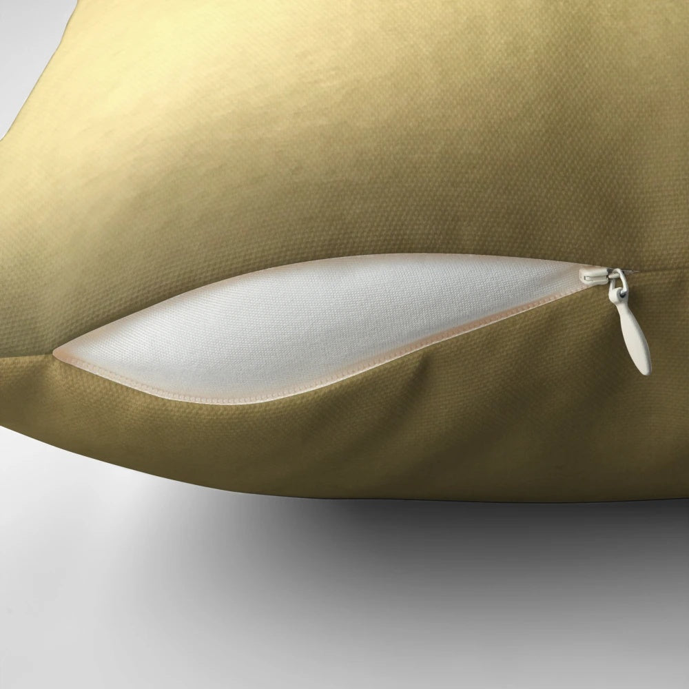 Metallic gold decorative pillow with shimmering finish