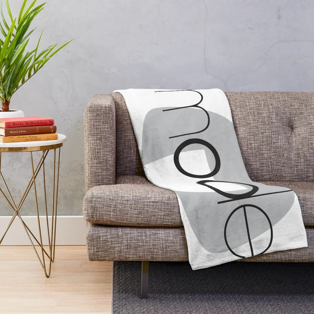 Stylish and cozy plush blanket designed with a superhero movie theme